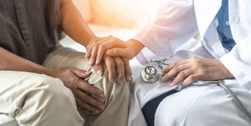 Parkinson's disease patient, Arthritis hand and knee pain or mental health care concept with geriatric doctor consulting examining elderly senior aged adult in medical exam clinic or hospital